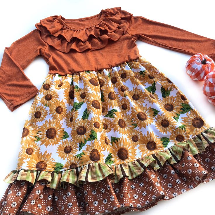 Our Autumn Flower Lola style dress is fashioned in a ruffle heathered Autumn Orange & a cotton ruffle skirting, perfect for wowing the crowd! Custom designed from a delightful mix of prints that please & colors that pop. Great for Thanksgiving, Fall portraits, school events, portraits, & everyday wear! All designs are tagged in the EVEN size. The model is 40.5”, 40lbs & modeling the sz 4/5 with a lot of room/length.Size/length: 2/3: 21”3/4: 22.5”4/5: 24”5/6: 25” 6/7: 26” 8: 28”Chest width unstretched: 2/3: 22”3/4: 22.5”4/5: 24” 5/6: 25”6/7: 26”8: 28” ✻ Ships in 1-4 days! Please leave a note during checkout if there is a specific date that you need your order by. ✻ We can typically accommodate rush orders, even large rush orders. Please inquire, by messaging me, with your needed date. Cute Long Sleeve Dresses With Ruffles, Cute Long Sleeve Dress With Ruffles, Flowy Long Sleeve Dresses With Ruffled Skirt, Multicolor Tiered Skirt Dress With Ruffle Hem, Cute Spring Twirl Dress With Ruffles, Flowy Floral Dress With Ruffles For Fall, Cute Flowy Twirl Dress With Ruffles, Cute Flowy Ruffle Hem Dress, Cute Fitted Ruffle Dress For Garden Party