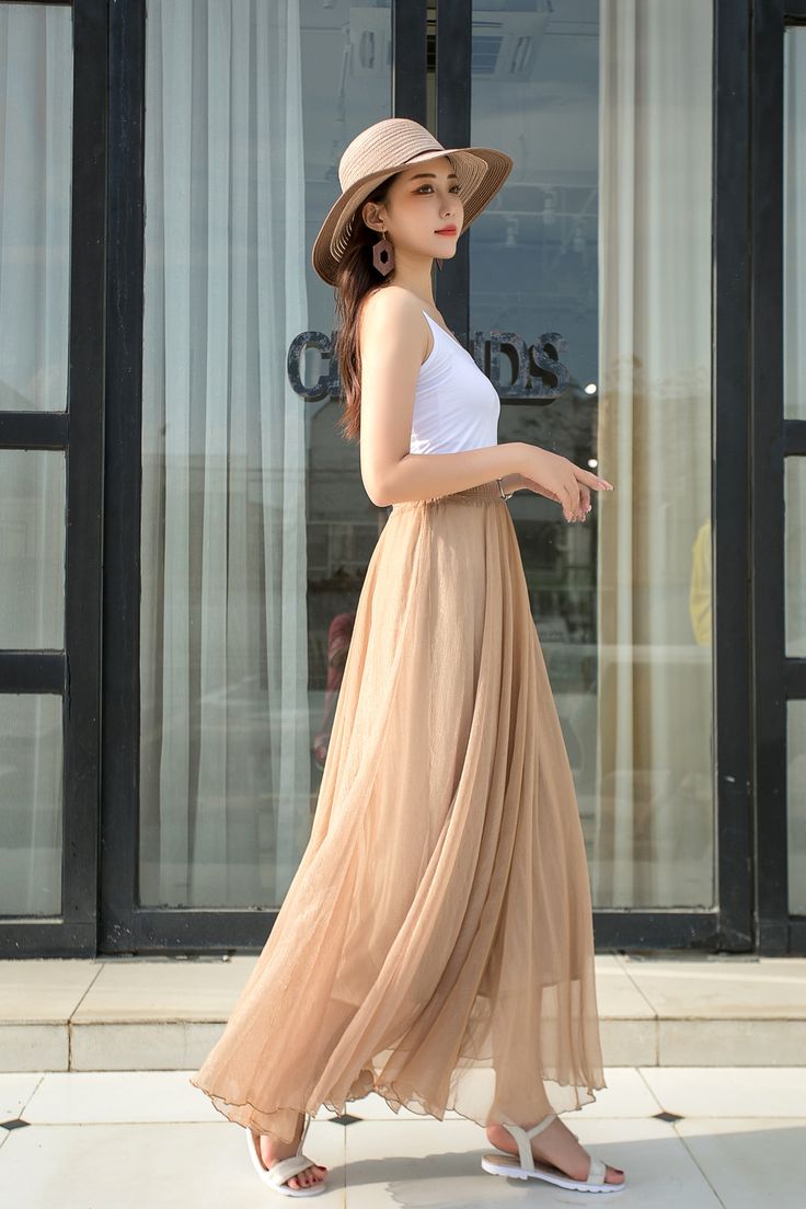 "DETAILS: * Chiffon Skirt * Chiffon Lining * No Pockets * around elastic waistband * Circle Skirt * Big swing skirt * Perfect for spring, summer and autumn * Machine Washable in Warm/Cold Water; Do not bleach / Mid-iron / Hang Dry * More colors *The model is 170 cm (5′7″) tall with a 80 cm (31.5\") bust, 66 cm (26\") waist. She is wearing the skirt in color khaki (No. 8) in one fit size with length 100 cm. * Choose CUSTOM Order if you Can't find your size in our size Chart Chang the Length Your Summer Midi Pleated Skirt, Pleated Chiffon Tiered Maxi Skirt, Summer Pleated Maxi Length Bottoms, Summer Pleated Maxi Bottoms, Beach Pleated Maxi Skirt, Non-stretch Tiered Maxi Skirt For Summer, Pleated Long Skirt For Vacation, Summer Maxi Length Pleated Bottoms, Long Pleated Vacation Skirt