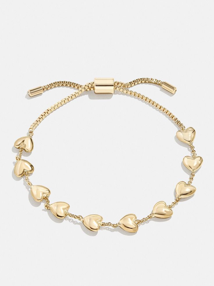 The Brittany Bracelet is the perfect way to add a subtle dose of affection to your curated wrist stack. This bracelet features petite heart adornments with chic negative space in between. Better yet, it's finished off with a pull-tie closure, meaning you'll always get the perfect fit. Things To Put On Your Christmas Wishlist, Cute Gold Bracelets, Good Christmas Presents, Preppy Jewlery, Pinterest Wishlist, Girly Christmas Gifts, Pinterest Shop, Bday Wishlist, Wishlist Ideas