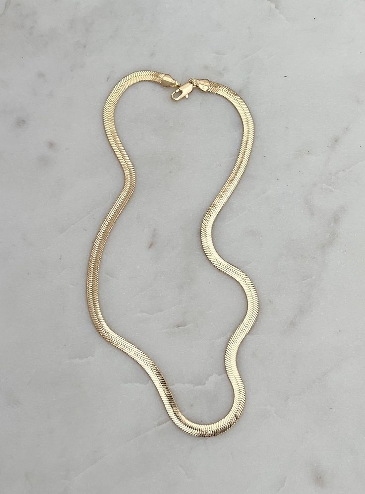 Make a statement with this gleaming 18k gold plated over brass snake chain. Perfect on it's own or layered with your favs. Length is about 16 inches CARE: This chain is 18k gold plated over brass. For long lasting wear, please refrain from wearing with lotions, water, perfume, etc. Yellow Gold Snake Chain Necklace, Everyday Gold-plated Snake Chain Necklace, Gold Plated Snake Chain Necklace For Everyday, Everyday Gold Plated Snake Chain Necklace, Gold Plated Tarnish Resistant Snake Chain Necklace, Gold-plated Tarnish Resistant Snake Chain Necklace, Gold-plated Tarnish-resistant Snake Chain Necklace, Gold Plated Snake Shaped Necklace With Adjustable Chain, Yellow Gold Snake Chain Necklace With Adjustable Chain