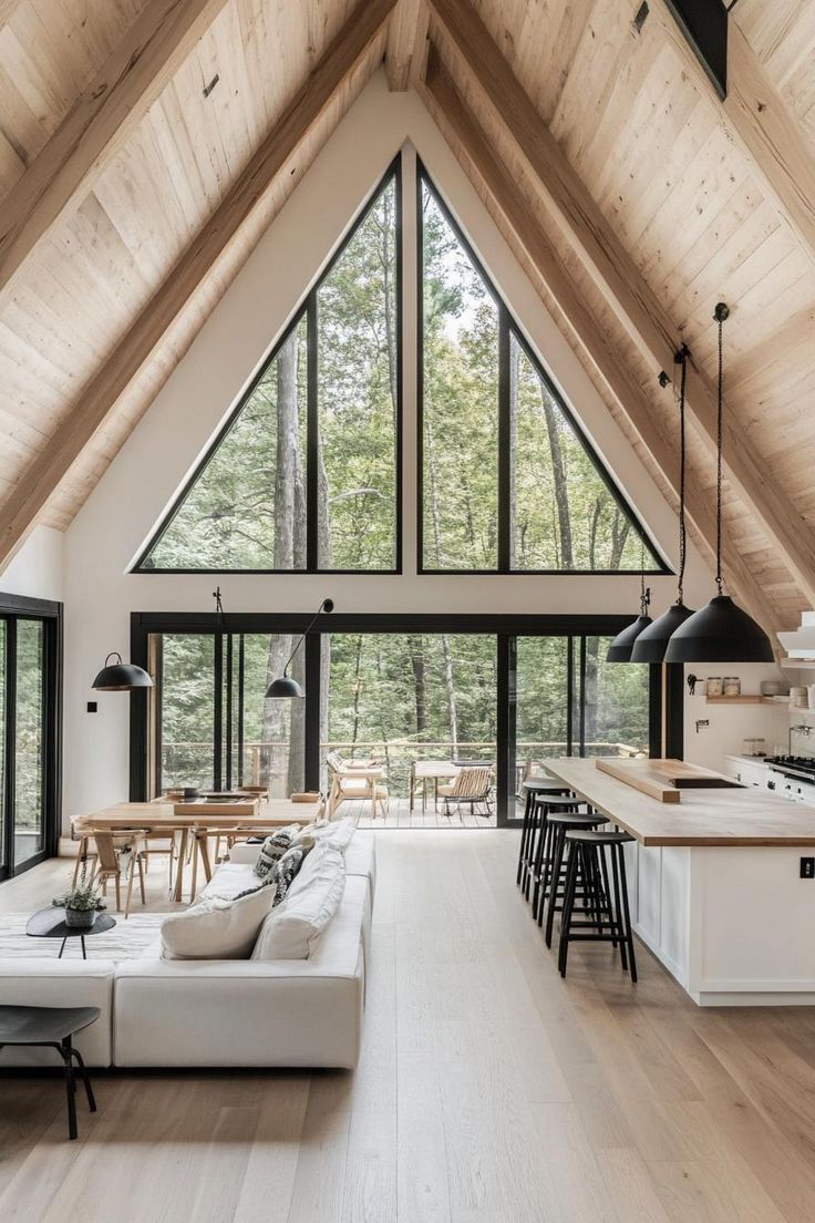 a living room filled with furniture and lots of windows