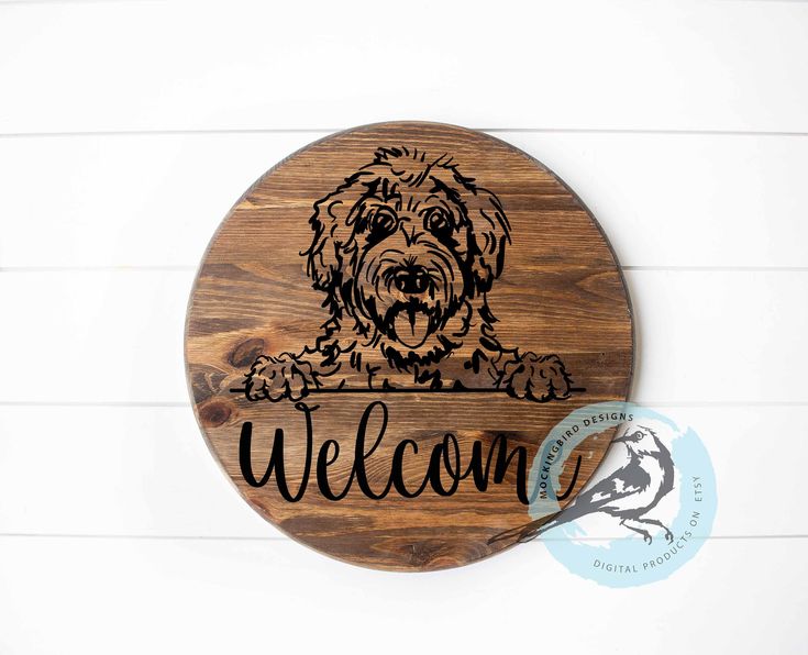 a wooden sign that says welcome with a dog on it