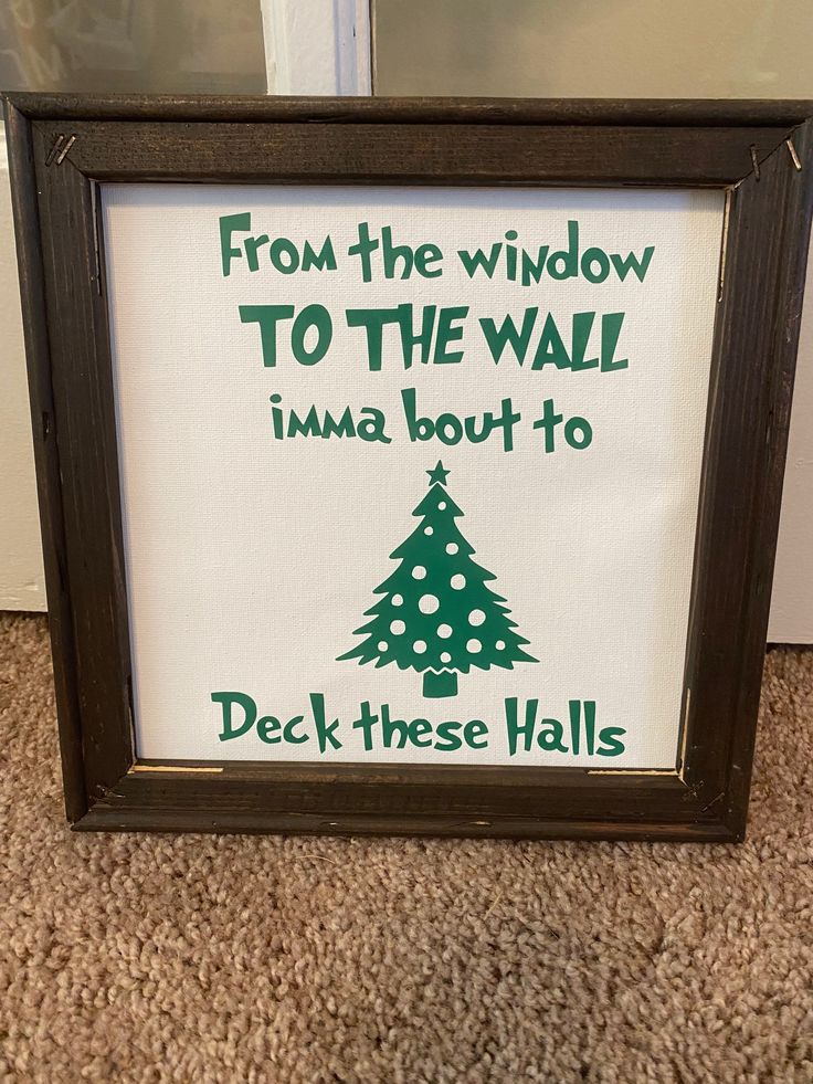 a framed sign that says from the widow to the wall i'm about to deck these walls