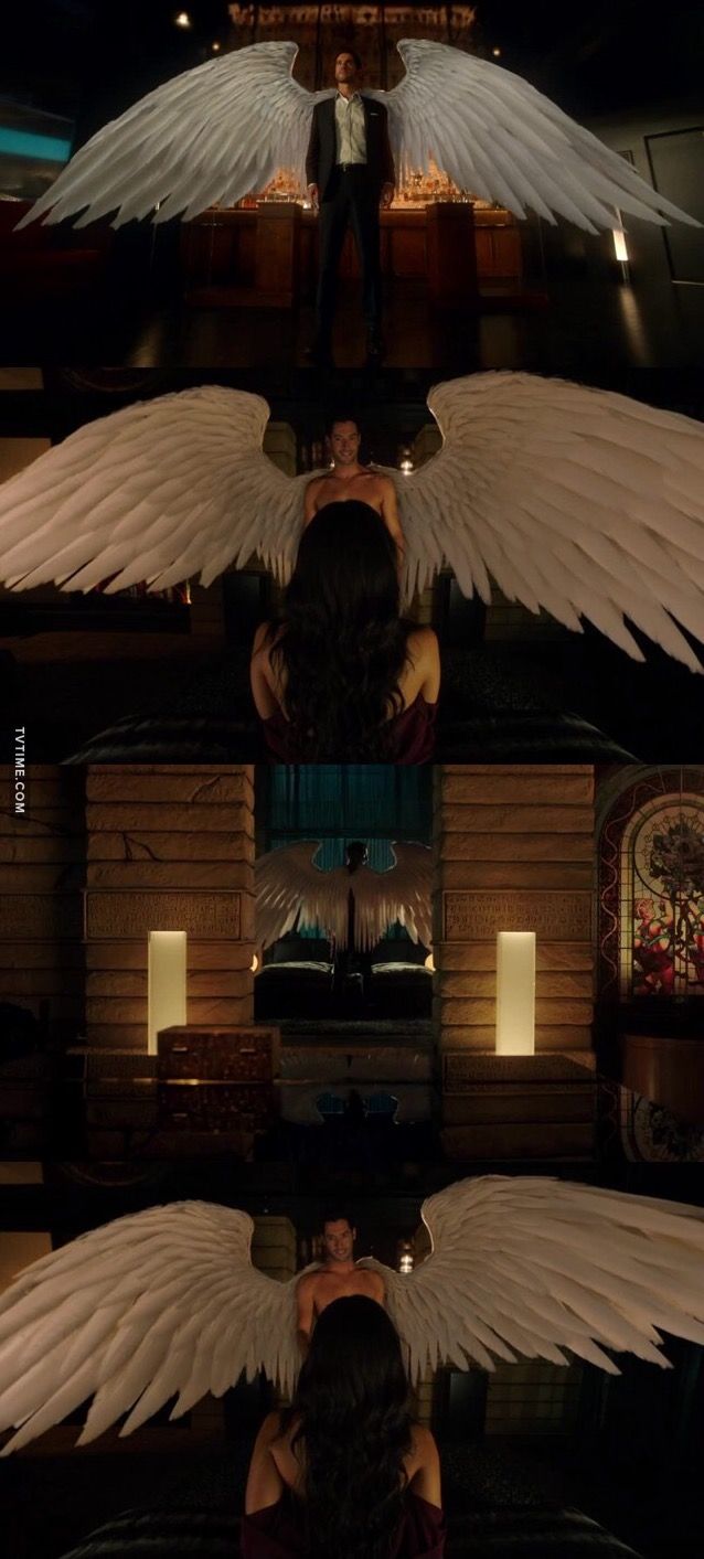 the reflection of two people in a mirror with angel wings on it's side