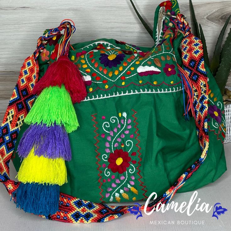 Chic and trendy handmade boho tote with Puebla Design and braided shoulder strap that can double as a belt. Comes with a handmade cotton tassel and inner cotton lining. MEASUREMENTS:Height: Tallest point - 17" Lowest Pint - 12"Length: 16"Width: 6.5"Shoulder Strap drop: 22.5"Measurements may vary from one piece to the other due to item being hand made. FEATURES: Model: Boho tote Style: SachelLining: Cotton.Closure: ZipperMaterial: 100% Cotton (Poplin) fabric with cotton embroidery. Shop our entir Bohemian Hobo Bag With Braided Handles For Spring, Summer Festival Cotton Hobo Bag, Spring Bohemian Woven Hobo Bag, Casual Green Embroidered Shoulder Bag, Bohemian Cotton Bag With Braided Handles, Summer Bohemian Cotton Hobo Bag, Bohemian Cotton Shoulder Bag For Market, Bohemian Handmade Cotton Hobo Bag, Handmade Bohemian Cotton Hobo Bag