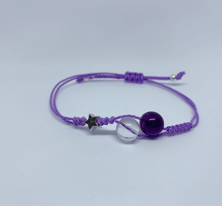 Purple amethyst and clear quartz bracelet  This bracelet is made with genuine amethyst and clear quartz beads and sterling silver beads. Materials: 8mm amethyst  8mm clear quartz  Sterling silver beads  Waxed cord  This bracelet is adjustable. Purple Resizable Beaded Bracelets For Gifts, Adjustable Amethyst Crystal Bracelet Gift, Purple Beaded Bracelets With Sliding Knot As Gift, Purple Adjustable Bracelets As Gift, Adjustable Purple Crystal Spiritual Bracelet, Purple Adjustable Bracelet For Gift, Gift Purple Beaded Bracelets With Sliding Knot, Purple Adjustable Length Bracelet As Gift, Adjustable Amethyst Beaded Bracelet Gift