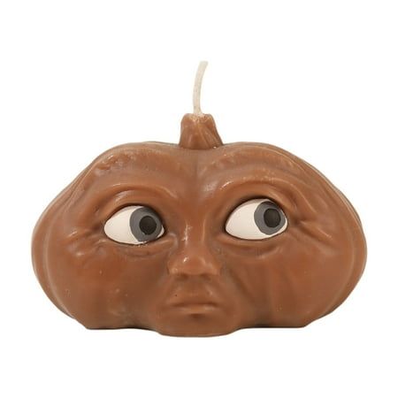 a chocolate pumpkin shaped candle with eyes on it's face and the word happy halloween written in white