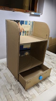 an open cardboard box sitting on top of a table