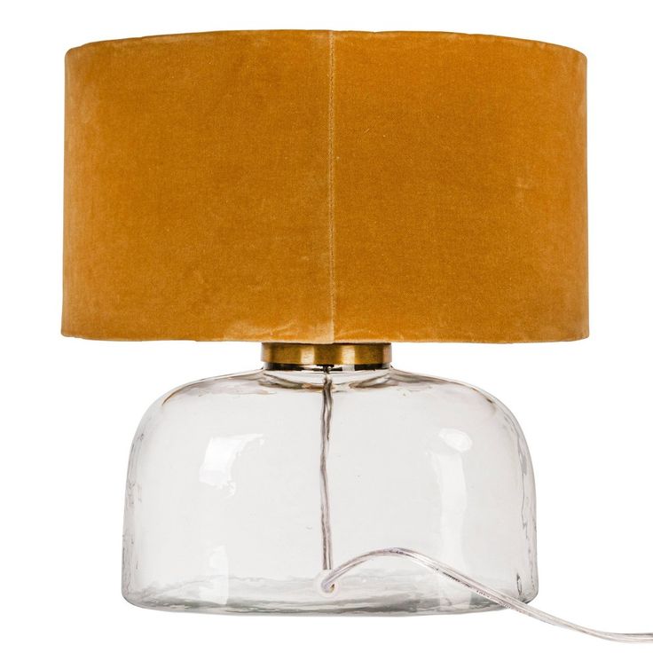 a glass table lamp with a brown shade on it's side and a cord attached to the base