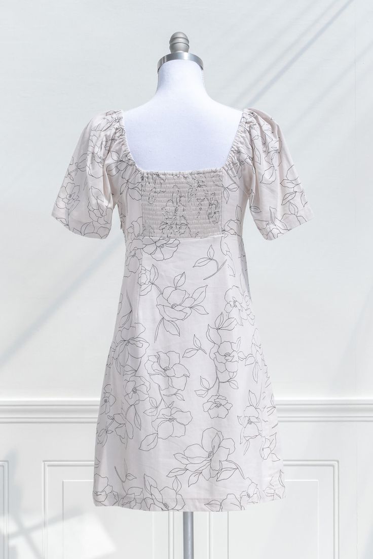 A lovely little summer dress, the May Melody mini dress features a floral print on white blend linen, a sweetheart neckline with empire waist, side-seam zipper, and short sleeves. Please Note- This item is final sale only. . Details: S: Bust: 34"-36", Length: 34" M: Bust 36"-38", Length: 34.5" L: Bust 38"-40", Length: 35" Length Measured from Shoulder Unlined Material: 76% Rayon, 22% Linen Gentle Wash Cold / Hang Dry Imported Ships Within 1 to 2 Business Days Free US Shipping Over $100 Brunch Mini Dress With Fitted Bodice And Short Sleeves, Lined Mini Dress With Fitted Bodice And Short Sleeves, Short Sleeve Mini Dress With Fitted Bodice, Fitted Bodice Mini Dress With Short Sleeves And Lining, Cotton Lined Short Sleeve Mini Dress, Cotton Short Sleeve Lined Mini Dress, Cotton Mini Dress With Short Sleeves And Lining, Lined Short Sleeve Mini Dress For Garden Party, Cotton Mini Dress With Short Sleeves For Garden Party