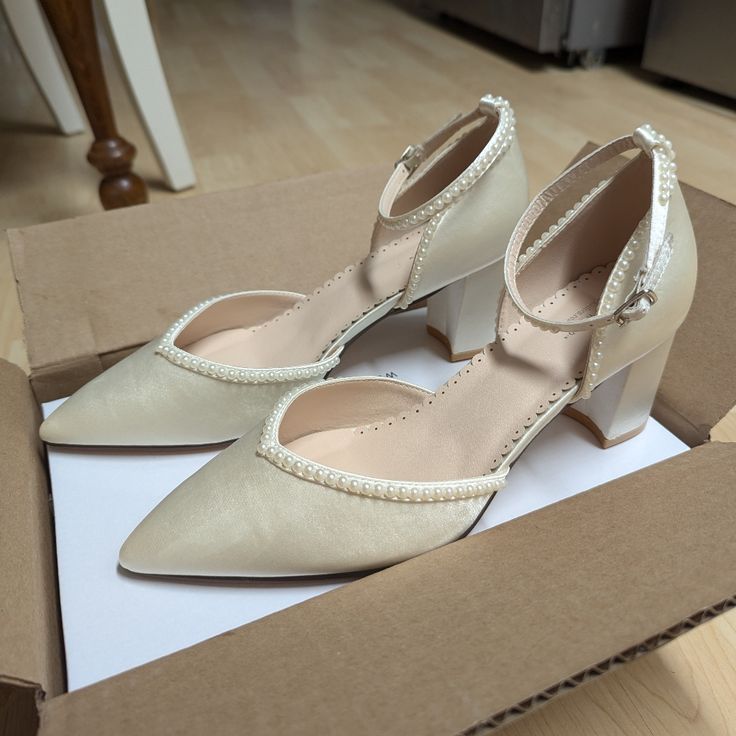 These Are Size 11 Ivory "Block Heel With Pearl Detail Bridal Shoes" I Ordered For My Wedding. I Love Them, But Unfortunately They Are A Little Small -- Fitting Me Like A 10 Normally Would -- And Kailee P Does Not Have A Larger Size, So I Cannot Exchange. They Are Originally $169, But I Paid $130 For Them After A Discount For A Small Imperfection (Wrinkle) On The Inside Of The Left Shoe, Shown In The Last Photo. They Have Not Been Worn, Only Tried On Once In My Home. Cream Court Shoes With Heel Strap And Pointed Toe, Cream Pointed Toe Court Shoes With Heel Strap, Chic Beige Block Heel Wedding Shoes, Cream Closed Toe Heels With Heel Strap, Cream Court Shoes With Heel Strap And Almond Toe, Cream Block Heel Court Shoes For Formal Occasions, Cream Almond Toe Court Shoes With Heel Strap, Cream Court Shoes For Spring Wedding, Chic Cream Block Heel Wedding Shoes