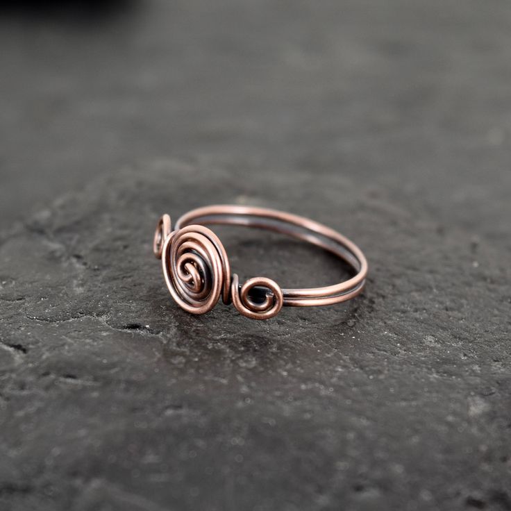 These rings are made with copper wire.  ✩ The item comes in a branded gift box- perfect for gifting.  ✩ All items are handcrafted by myself and every effort is taken to produce a high quality product.  ✩ If you have particular questions, send me a message! I am also doing jewelry upon request, so if you have an idea of what you want me to make for you, please get in touch to talk about it! Minimalist Hand Forged Stackable Rings For Gift, Minimalist Hand Forged Stackable Rings As Gift, Minimalist Hand Forged Midi Rings As Gift, Handmade Minimalist Rose Gold Midi Rings, Minimalist Hand Wrapped Ring For Gift, Gift Wire Wrapped Midi Rings, Hand Wrapped Rose Gold Ring Gift, Rose Gold Hand Wrapped Ring As Gift, Hand Forged Spiral Rings For Gifts