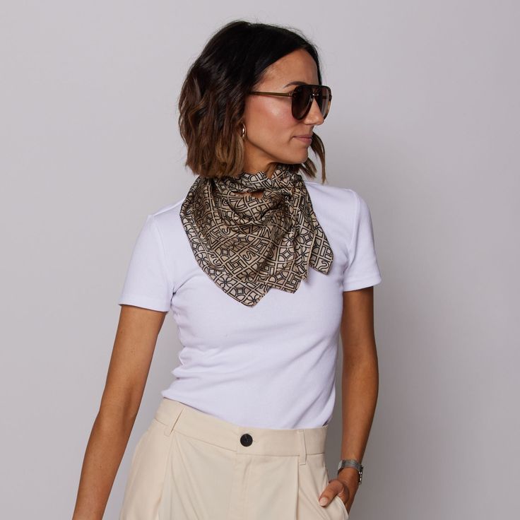 Turn heads with our N&S Signature Scarf! This lightweight and sheer tan scarf is decorated with our elegant N&S signature logo pattern that will make any outfit stand out. Made from the softest fabric to feel luxurious against the skin, this scarf is perfect for every occasion! Elegant Beige Scarves For Workwear, Chic Beige Scarves For Fall, Chic Beige Fall Scarves, Chic Beige Scarf For Fall, Elegant Gold Scarves For Spring, Elegant Cream Scarves For Fall, Chic Cream Scarves For Spring, Chic Cream Scarf For Spring, Elegant Summer Scarves For Workwear