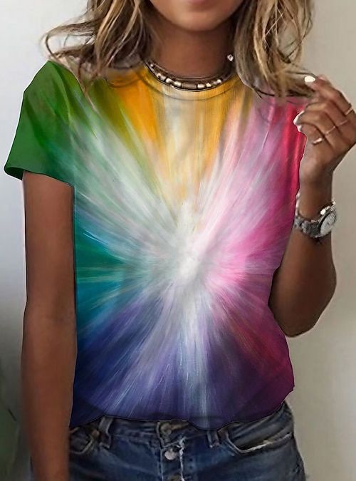 a woman wearing a colorful tie dye t - shirt posing for the camera with her hand on her hip