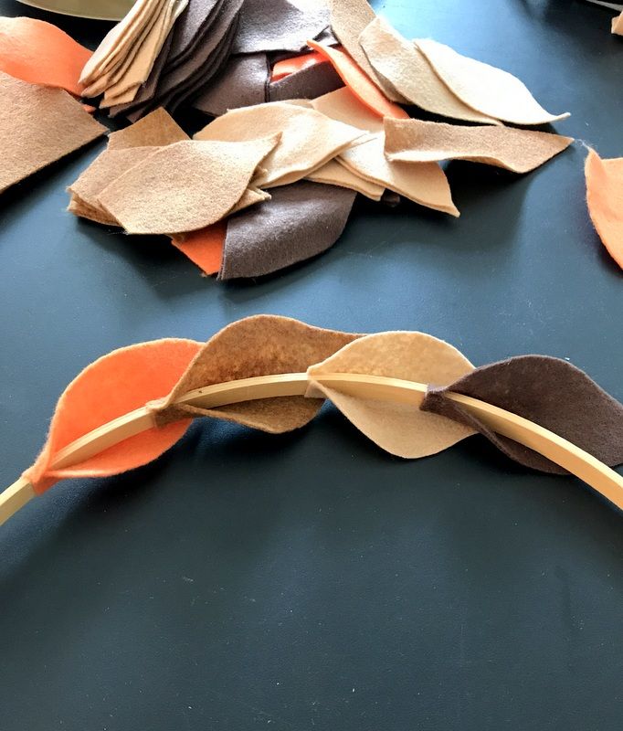 several pieces of paper that have been cut into shapes and are laying on a table