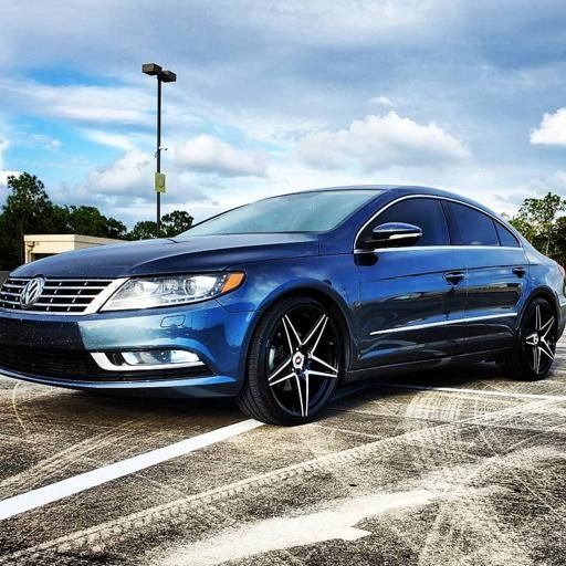 a blue car parked in a parking lot