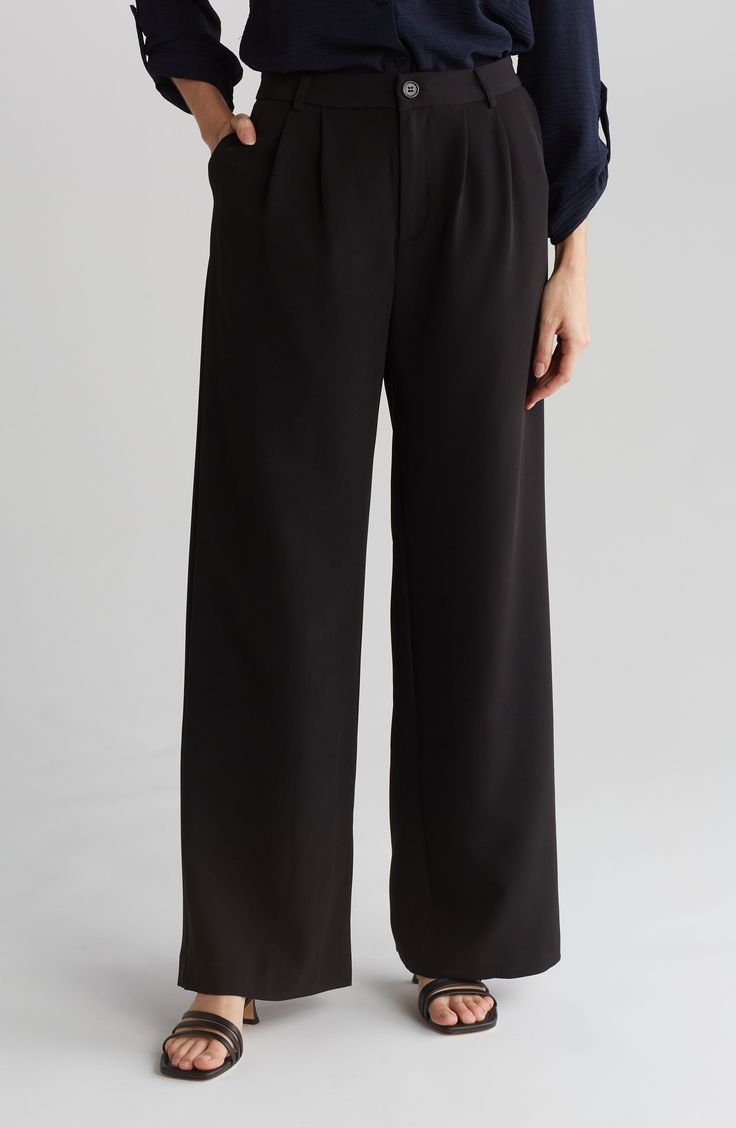 A wide leg furthers the chic appeal of these pants made from stretchy crepe fabric. 30" inseam; 12 1/2" rise (size Small)
 Zip fly with button closure 90% polyester, 10% elastane Machine wash, dry flat Imported Tailored Versatile Wide Leg Pants, Versatile Tailored Wide Leg Dress Pants, Tailored Wide-leg Dress Pants, Chic Black Semi-formal Pants, Tailored Wide Leg Versatile Pants, Versatile Formal Full Length Wide Leg Pants, Formal Wide Leg Bottoms With Button Closure, Black Wide Leg Culottes For Formal Occasion, Formal Wide-leg Bottoms With Button Closure