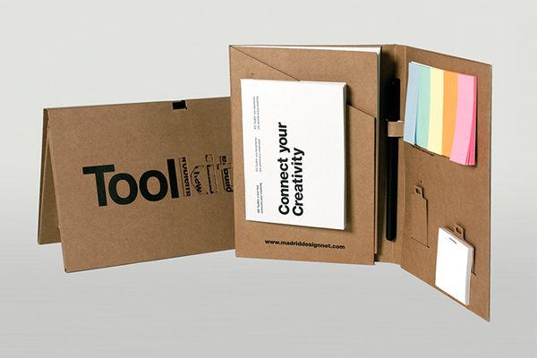 an open cardboard box with sticky notes and business cards in it, on top of a white background