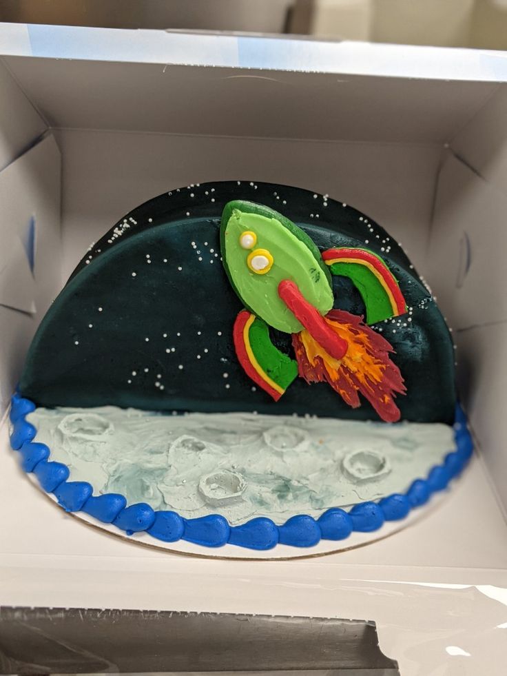 a cake in the shape of a rocket ship