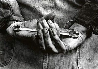 black and white photograph of person holding something in their hands with both hands on the other hand