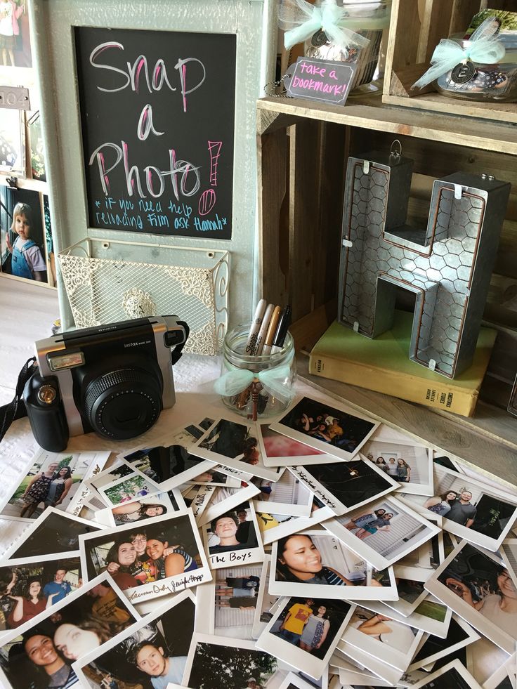 a pile of photos sitting on top of a table