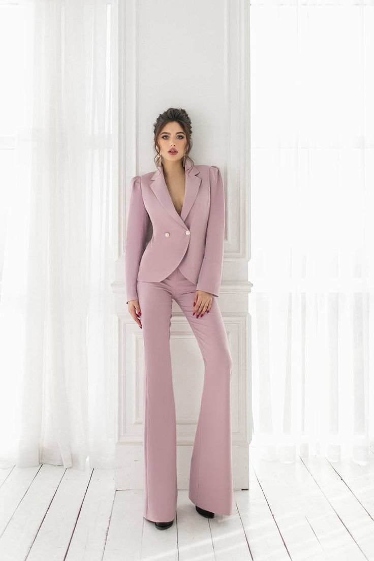 2-piece Womens Blazer Trouser Suit for office, business meetings, formal events and special occasions. Also perfectly combines with sneakers so after a long and tiring business day you can change you heels to sneakers and still look chic. DETAILS - flared pants - slim fit - high rise - blazer is buttoned - lined - side pockets - slim fit - double breasted MATERIAL Premium quality suiting fabric, which consists of viscose mostly and a bit of polyester and elastane SIZES The models in photos are w Chic Fitted Pantsuit For Semi-formal Occasions, Chic Formal Long Sleeve Sets, Chic Long Sleeve Formal Sets, Office Lady Pantsuit With Suit Collar, Office Wear Long Sleeve Pantsuit, Tailored Long Sleeve Pantsuit For Party, Chic Fitted Sets With Suit Collar, Elegant Tailored Dress Pants For Party, Elegant Office Pantsuit