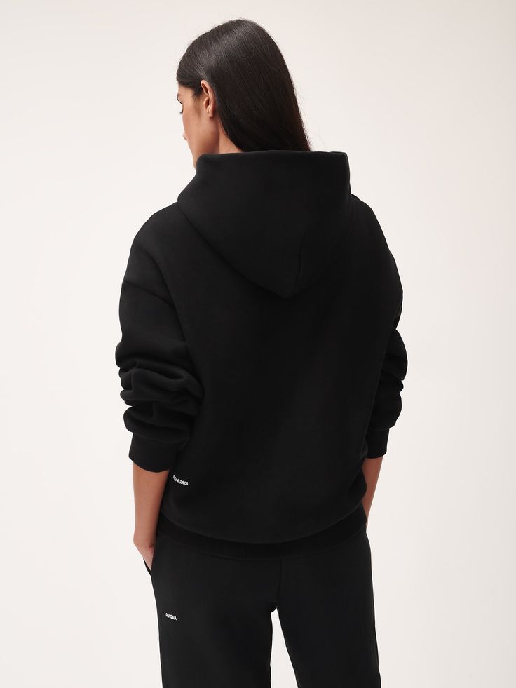 THE PANGAIA 365 HEAVYWEIGHT HOODIE IN BLACK IS MADE FROM 50% ORGANIC COTTON AND 50% RECYCLED COTTON. TREATED WITH PPRMNT™ FOR ANTI-ODOR PROPERTIES, HELPING KEEP YOUR HOODIE FRESHER FOR LONGER. THE HEAVYWEIGHT FABRIC AND BRUSHED INTERIOR PROVIDE A STRUCTURED SHAPE AND SOFT FEEL. THIS GENDERLESS HOODIE PROVIDES WARMTH AND DURABLE COMFORT FOR YEAR-ROUND WEAR. Saving Water, Heavyweight Hoodie, Eco Clothing, Water Energy, Designer Hoodies, Peppermint Oil, Natural Plant, Harmful Chemicals, Sustainable Clothing