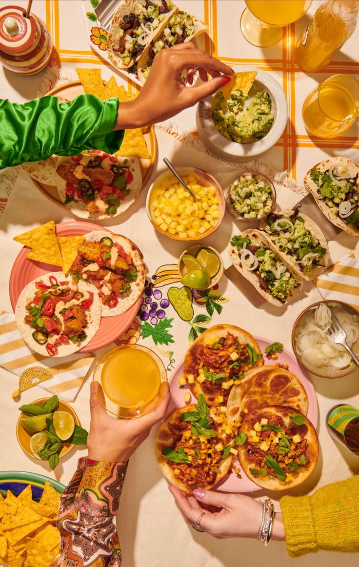 people are eating mexican food at a table