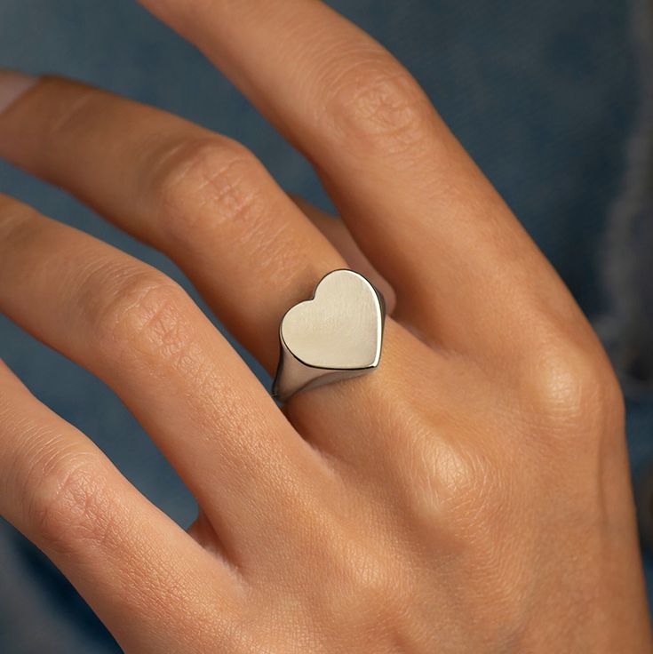 The heart shape signet ring, made in 14k or 18k solid white gold. This listing is for WHITE GOLD. You can see and order in white or rose gold from the following links: ● Yellow gold - https://www.etsy.com/listing/1065632767/ ● Rose gold - https://www.etsy.com/listing/1092114936/ -------------------DIMENSIONS------------------- The heart shape is about 13 mm long. -------------------CUSTOMIZATION------------------- ● This ring can be custom-made to your preferences. ♥ Feel free to contact me for Large Gold Ring, Ring Heart Shape, Heart Signet Ring, Heart Shape Ring, Wedding Ring Sets Unique, Custom Signet Ring, Gold Stacking Ring, Gents Ring, Stamped Rings