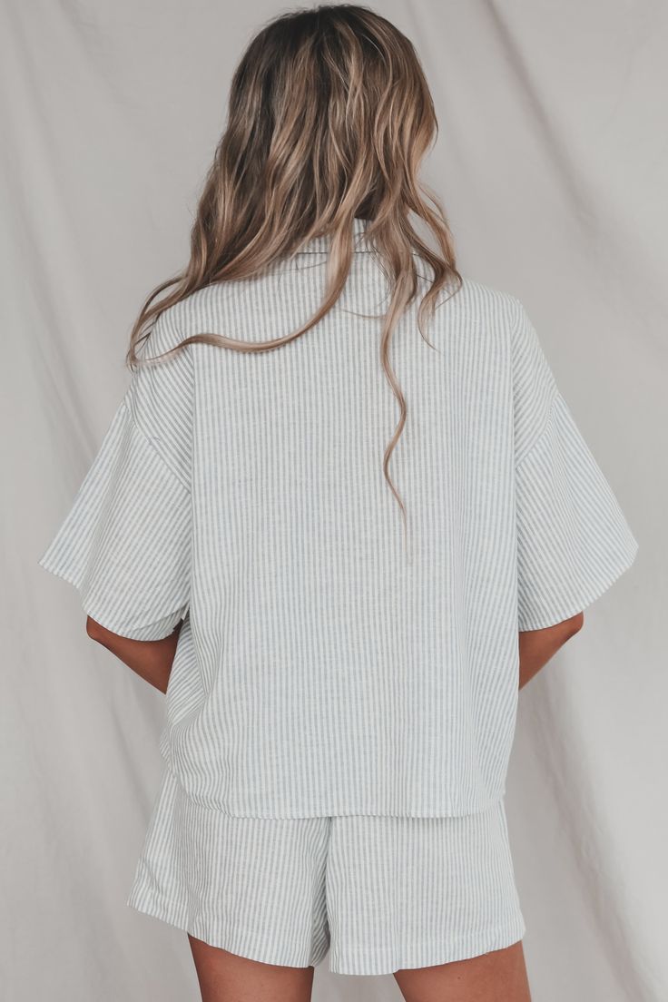 Looking for the perfect boat day attire? Look no further than this lightweight button up top. Pairs perfectly with our Having A Boat Day Striped Shorts. Blue and white boxy vertical stripe button down Material is Linen Hang to dry Model is 5'9 wearing a small SHOP THE LOOK Small Medium Large Length 23.5” 24.5” 25.5” Bust 22” 23” 24” Boat Day, Button Up Top, Shop The Look, Striped Shorts, Small Shop, Button Up, Blue And White, How To Wear, Blue