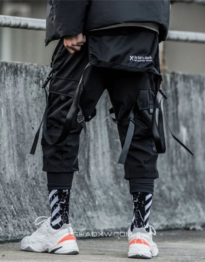 Shop the Techwear Pants with Straps inspired by techwear and cyberpunk culture. The essential accessory to finalize your futuristic style. ✅ Free worldwide shipping✅. Techwear Cargo Pants For Outdoor Activities, Functional Cargo Pants For Streetwear With Belt Loops, Nylon Techwear Cargo Pants With Belt Loops, Urban Parachute Pants With Belt Loops For Outdoor, Urban Parachute Pants For Outdoor With Belt Loops, Combat Style Nylon Cargo Pants With Pockets, Combat Style Cargo Pants With Belt Loops For Outdoor, Techwear Pants With Belt Loops For Outdoor, Techwear Nylon Pants With Belt Loops