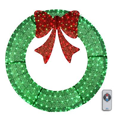 a christmas wreath with red and green lights