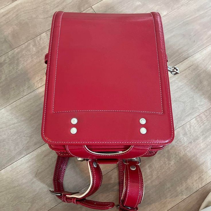 Randoseru : This randoseru made by Tsuchiya Bag company Which is one of the best randoseru maker in Japan. Its made by high quality Cowhide.  Item: Cowhide Leather school Bag / Japanese Randoseru - Red & White No.rnd009 Condition: Used/ Good. Please check the listing pictures. Size: Adult Wearable You could put your laptop without any ploblem. Tsuchiya Bag Company / Made in Japan Tsuchiya bag is one of the best randoseru maker in Japan. https://fujiyamarock.etsy.com Shipping Japan Post takes abo Rectangular Laptop Bag For Students, School Satchel Travel Bag With Adjustable Strap, Functional Standard Backpack Shoulder Bag For Students, Adjustable Strap Leather Backpack For Students, Functional School Satchel With Adjustable Strap, Rectangular Student Backpack, Leather Bags For Students Back To School, Leather Bag For Back To School, School Laptop Bag Backpack With Luggage Sleeve