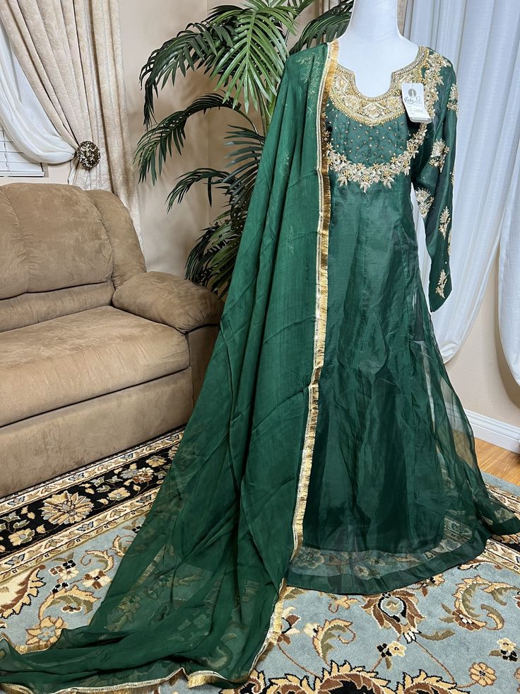 High quality is our top priority. Ready to wear can ship same business day. Color     Green  Fabric    shirt, dupatta (organza)                  trousers Qatan silk Embroidery details  Total handmade adda work Kora, Dabka, Stones, Pearls Block print and Lace on all four side borders On dupatta. Embroidery is very elegant and neat.  Stylish designer dress. perfect for mehndi, shadi, eid and formal occasions. size extra large shoulder 17 chest 24 waist 22.5 hips 25 maxi length 54 trouser length 39 Floor-length Organza Dress With Dabka Details, Floor-length Organza Dress With Dabka, Floor-length Raw Silk Lehenga With Dabka Detail, Floor-length Raw Silk Lehenga With Dabka, Art Silk Maxi Traditional Wear For Wedding, Art Silk Traditional Wear Maxi Length For Wedding, Art Silk Traditional Maxi Wear For Wedding, Floor-length Silk Salwar Kameez With Resham Embroidery, Organza Dress With Pallu For Eid