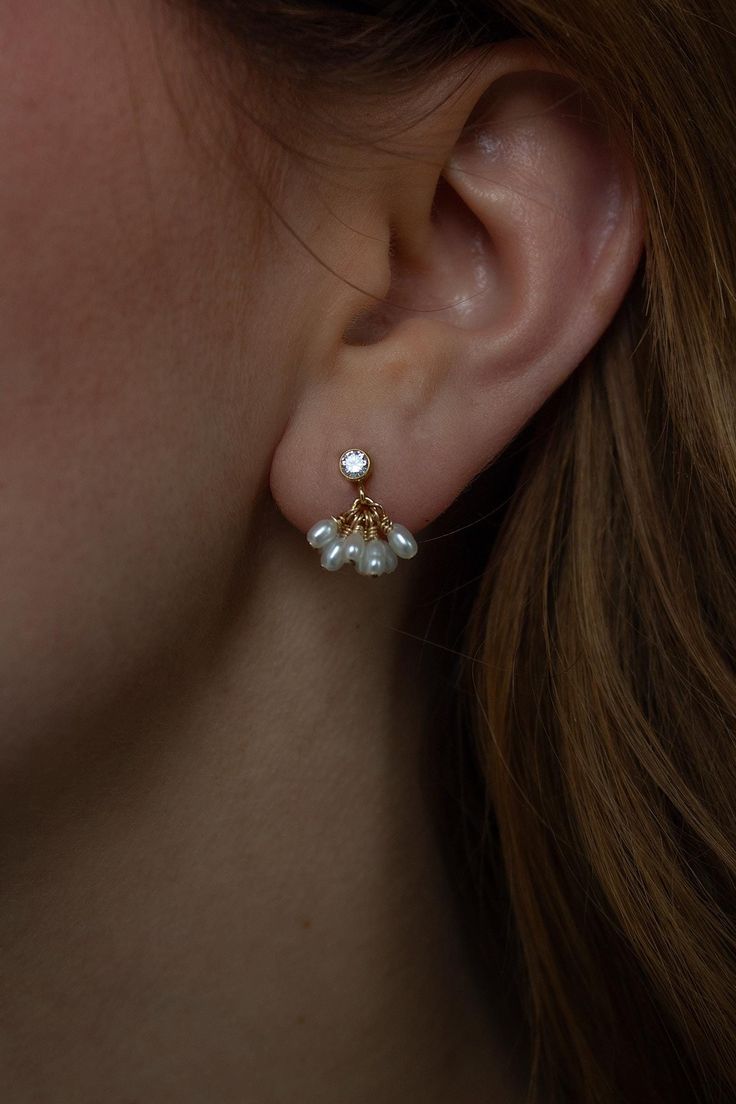 A dainty take on the signature fleurette design.  The Petite Bloom Earrings are perfect for everyday yet feel slightly elevated. They are the perfect earrings if you are looking for a simple statement.   Lightweight and comfortable to wear.  Due to the nature of natural pearls each pair is slightly different and unique to you. Closure: post Sold in pairs Materials: 14K Gold Filled or Sterling Silver Measures approx. 1/2" in length Handmade in New York Arrives perfectly packaged, ready for gift-giving! Christine Elizabeth, Simple Bridal Jewelry, Jewellery Diy, Elizabeth Jewelry, Earrings Dangle Simple, Minimal Necklace, Earrings Simple, Layered Jewelry, Silver Gifts