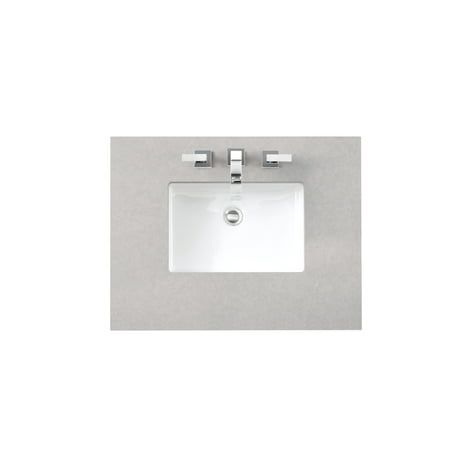 a bathroom sink with two faucets and a white porcelain counter top on the wall