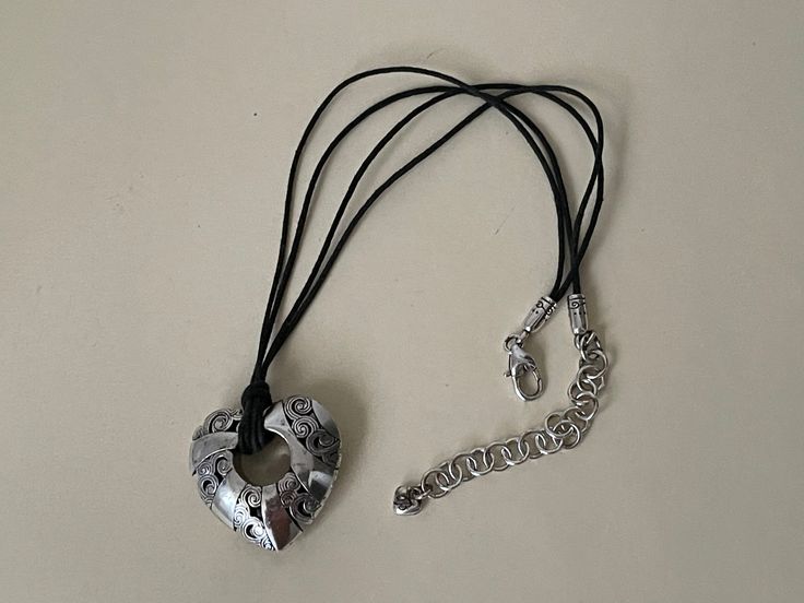 "Brighton Kismet Puffy black corded silver pendant necklace  Marked with Brighton tag  adjustable - 15.25\" - 18.25\"  heart size - 1 3/8\" x 1 3/8\"  Very good condition  09/06/23 1531" Puffy Heart, Silver Pendant Necklace, Brighton, Silver Pendant, Necklace Etsy, Silver Plate, Jewelry Necklace Pendant, Silver Plated, Jewelry Necklaces