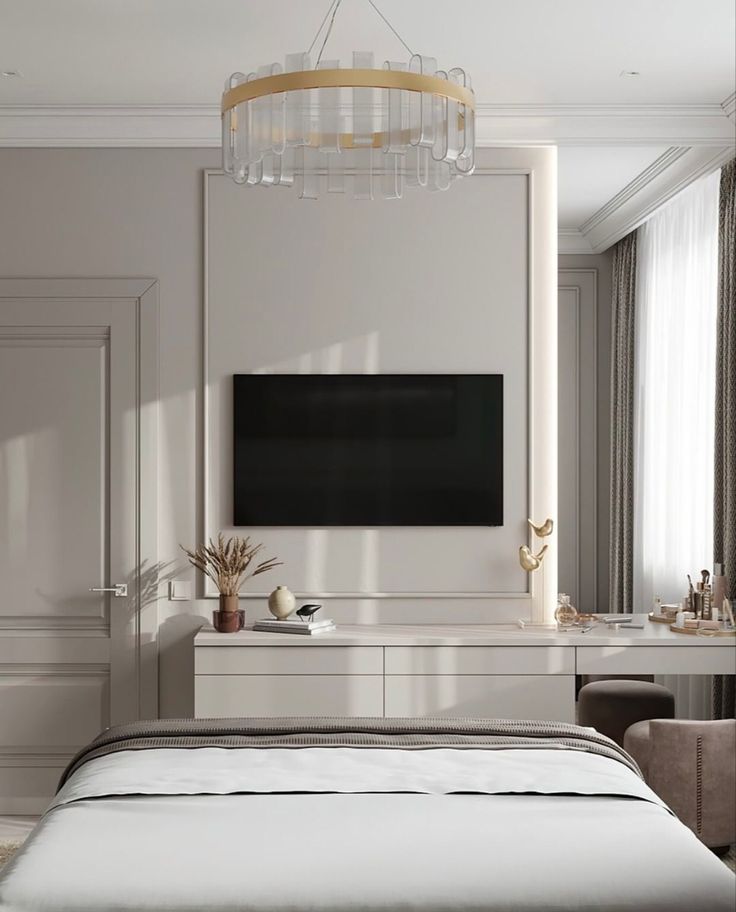 a bedroom with a bed, dresser and tv mounted on the wall in front of it