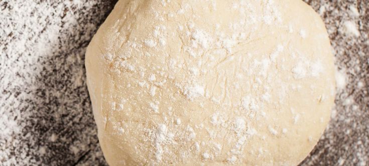 a ball of dough sitting on top of a table