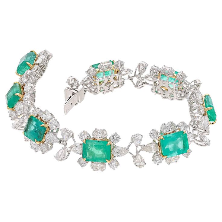 This is a stunning natural Zambian Emerald bracelet which has Emerald of very high quality and diamonds of very good quality . it has vsi clarity and G colour. Emerald : 19.35 cts diamonds : 12.67 cts gold : 19.406 gms Its very hard to capture the true color and luster of the stone, I have tried to add pictures which are taken professionally and by me from my I phone to reflect the true image of the item. It's a brand new piece so all measurements and Weight of the stone are accurate. Please rea Luxury Diamond Gemstone Bracelet, Luxury Diamond Gemstone Bracelets, Luxury Green Brilliant Cut Diamond Bracelet, Formal Emerald Diamond Bracelet With Brilliant Cut, Luxury Diamond Bracelets With Gemstones, Formal Emerald Gemstone Bracelets, Formal Diamond Gemstone Bracelets, Green Diamond Bracelet For Formal Occasions, Formal Emerald Diamond Bracelet