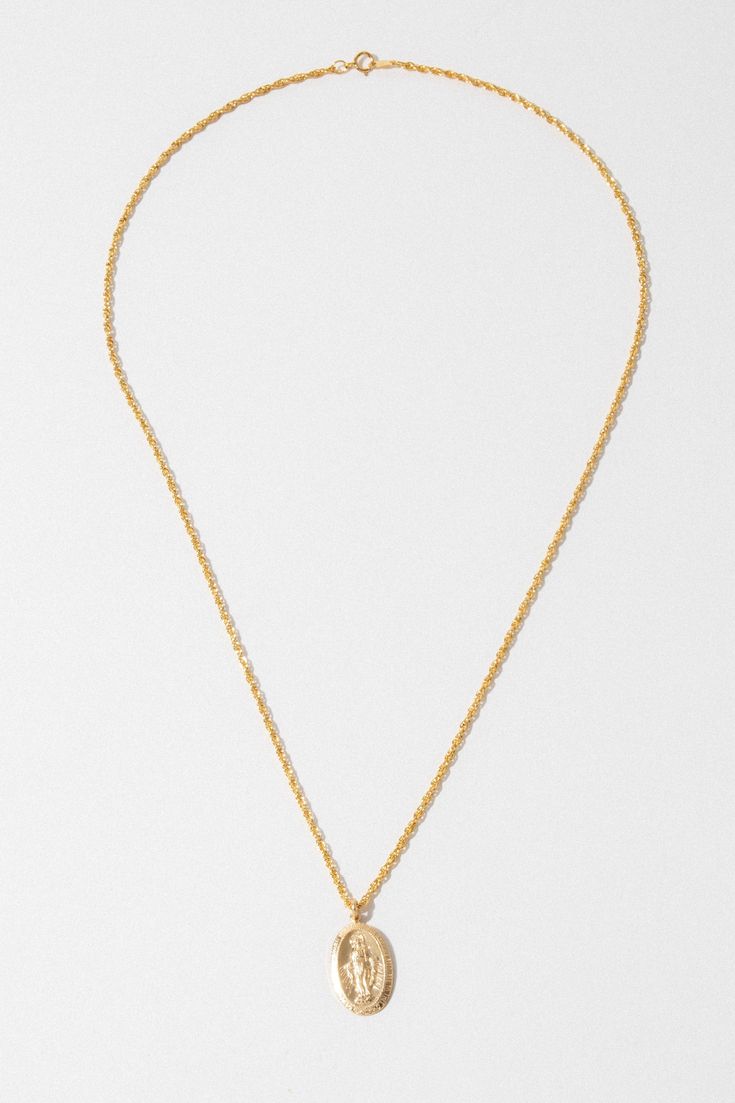 One of our all-time best-selling necklaces because of its quality, simplicity, and traditional Italian design. This necklace is adorned with a traditional religious "Miraculous Mary" double-sided pendant on a detailed twisted rope chain. ✦ Chain measures 18 inches / 14K GF ✦ Pendant measures .7 inches L x .5 inches W / 14K GF * Models wearing 18 inches * Available for custom order in 16 or 24 inches Dainty Necklace Gold, Necklace Gold Jewelry, Child Of Wild, Mary Necklace, Trendy Necklace, Jewelry Dainty, Classy Jewelry, Birthday List, Trendy Necklaces