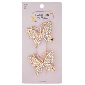 Let natural beauty take over your hair when you accessorize with these Rhinestone Butterfly Hair Clips! These metal alligator-style clips have a shiny gold finish and butterfly-shaped tops. The butterflies are angled diagonally and are covered in lots of iridescent rhinestones. Nobody will be able to look away from these dazzling butterflies! Dimensions: 	 Length: 2" 	 Width: 2" 	 Thickness: 1/2" Card contains 2 hair clips. Concert Hair Butterfly Clips, Gold Butterfly Clips, Gold Butterfly Hair Clips, Gold Butterfly Hair Pins, Crystal Butterfly Hair Clip, Butterfly Hair Clips, Wearable Art Fashion, Alligator Hair Clip, Butterfly Decor