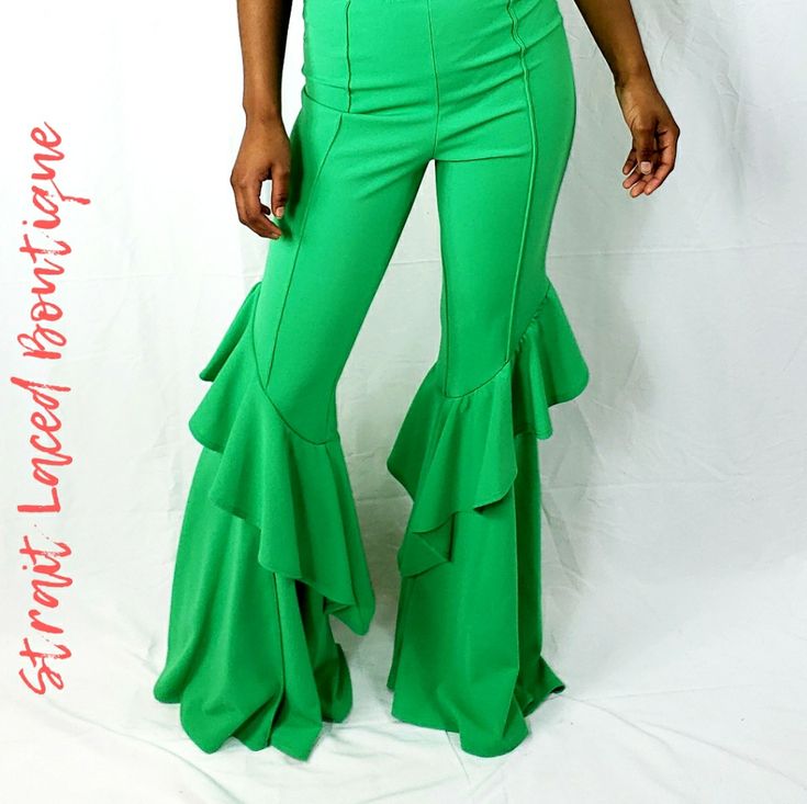 Unlock The Goddess In You In These Cute Green High Waisted Pants. These Pants Feature Stretch Fabric, Elasticized Waist, And Ruffle Flared Legs. Pair This With Your Favorite Top And Heels And Be The Fashion Diva That You Are! 95% Polyester 5% Spandex Chic Full-length Ruffled Bottoms, Fitted Wide Leg Pants With Ruffles, Trendy Ruffled Stretch Pants, Fitted Ruffle Flare Pants, Fitted Flare Pants With Ruffles, Fitted Ruffled Flare Pants, Trendy Stretch Pants With Ruffles, Green High-waist Ruffled Bottoms, High-waist Green Ruffled Bottoms