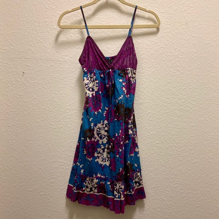 Perfect Condition! New With Tags! A Beautifully Designed Blue And Purple Strappy Dress. Excellent For Summer! There Is Some Beading Detail Throughout As Well. The Straps Are Adjustable, So You Can Make It Work For You! Brand: Rampage Condition. Brand New With Tags Size: S Purple Cotton Beach Dress, Casual Purple Sundress For The Beach, Purple Floral Print Sundress For Vacation, Purple V-neck Sundress For The Beach, Purple V-neck Beach Sundress, Purple Cotton Summer Sundress, Summer Purple Cotton Sundress, Summer Cotton Sundress In Purple, Purple Floral Print Sundress For Beach