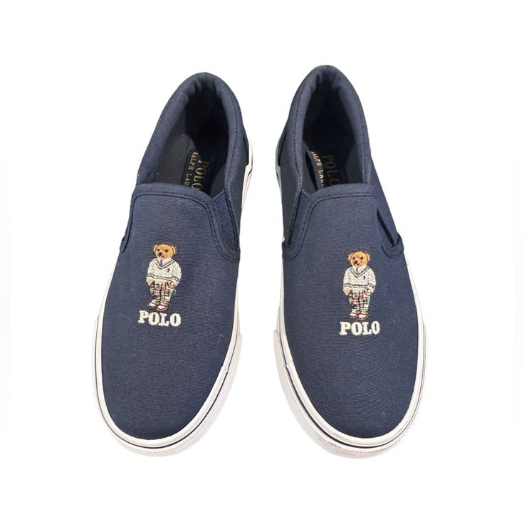 Polo Ralph Lauren Bear Slip On Navy Blue Shoe New Kids Size 1 These Canvas Slip-On Sneakers Are Detailed With A Preppy-Style Polo Bear Embroidery. Canvas Upper Round Toe Slip-On Style Lining: Cotton Rubber Sole Casual Blue Slip-ons With Round Toe, Navy Slip-ons With Rubber Sole And Round Toe, Blue Slip-on Sneakers With Rubber Sole, Navy Round Toe Slip-ons With Rubber Sole, Blue Slip-ons With Round Toe, Blue Slip-on Shoes With Round Toe, Navy Comfortable Sneakers With Round Toe, Comfortable Navy Sneakers With Round Toe, Navy Slip-on Sneakers With Round Toe