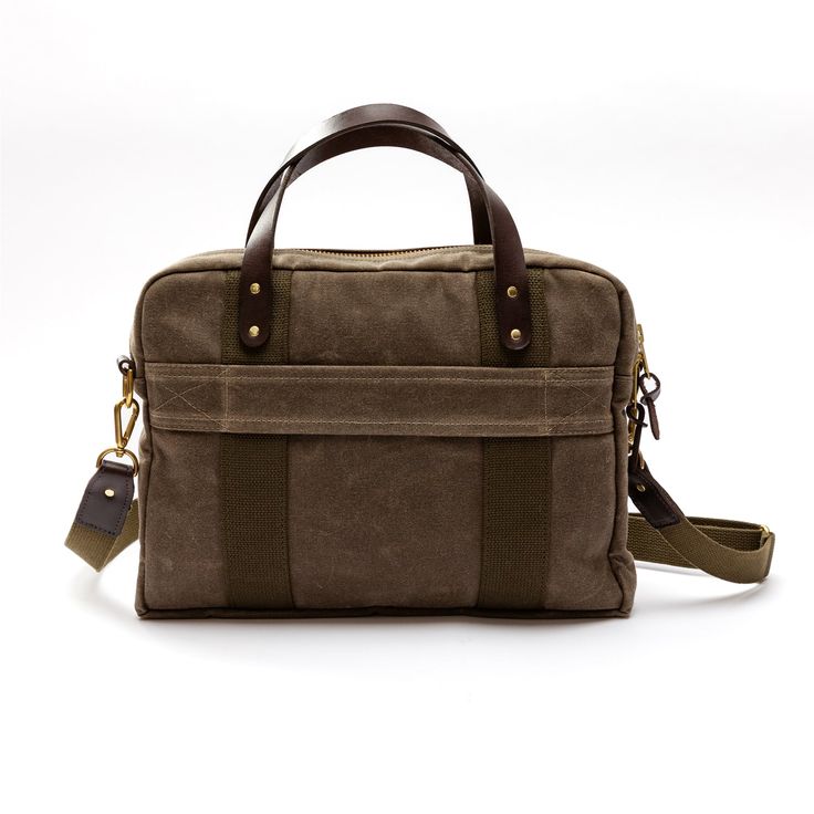 Description Elevate everyday with our Made in the USA Waxed Canvas Laptop Bag. Featuring a convenient trolley sleeve and an array of exterior and interior pockets, this bag seamlessly transitions from a sophisticated office accessory to a secure carry-on during your travels. Complete with signature details like our logo embossed metal tack, green cotton webbing and leather handles. Details 3.2"D x 12"H x 15"W 18 oz. Waxed Canvas Double Wax Canvas Bottom Nylon Lined Detachable Shoulder Strap With Canvas Laptop Bag, Wax Canvas, Sophisticated Office, Embossed Metal, Waxed Canvas, Office Accessories, Leather Handles, Green Cotton, Leather Handle