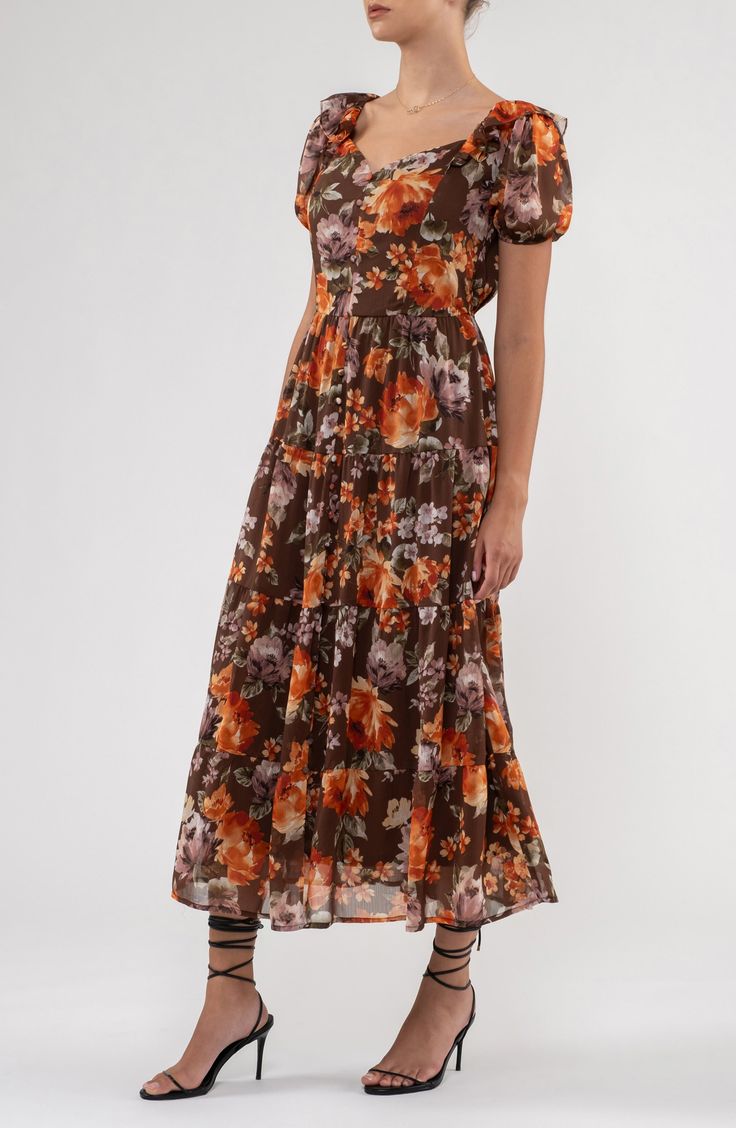 Blossoming flowers sweeten the look of an ankle-grazing maxi complete with ruffled trims for extra style points. 50" length (size Small) Sweetheart neck Short sleeves Lined 100% polyester Hand wash, dry flat Imported Model stats: 5'10" height, 32" bust, 25" waist, 36" hip. Model is wearing size Small. Flowy Tiered Brown Dress, Flowy Brown Tiered Dress, Brown Tiered Skirt Summer Dress, Brown Floral Print Maxi Dress For Garden Party, Flowy Brown Maxi Dress With Ruffles, Brown Maxi Dress For Spring Garden Party, Brown Ruffled Maxi Dress For Spring, Brown Ruffled Maxi Dress, Spring Floral Print Brown Maxi Dress