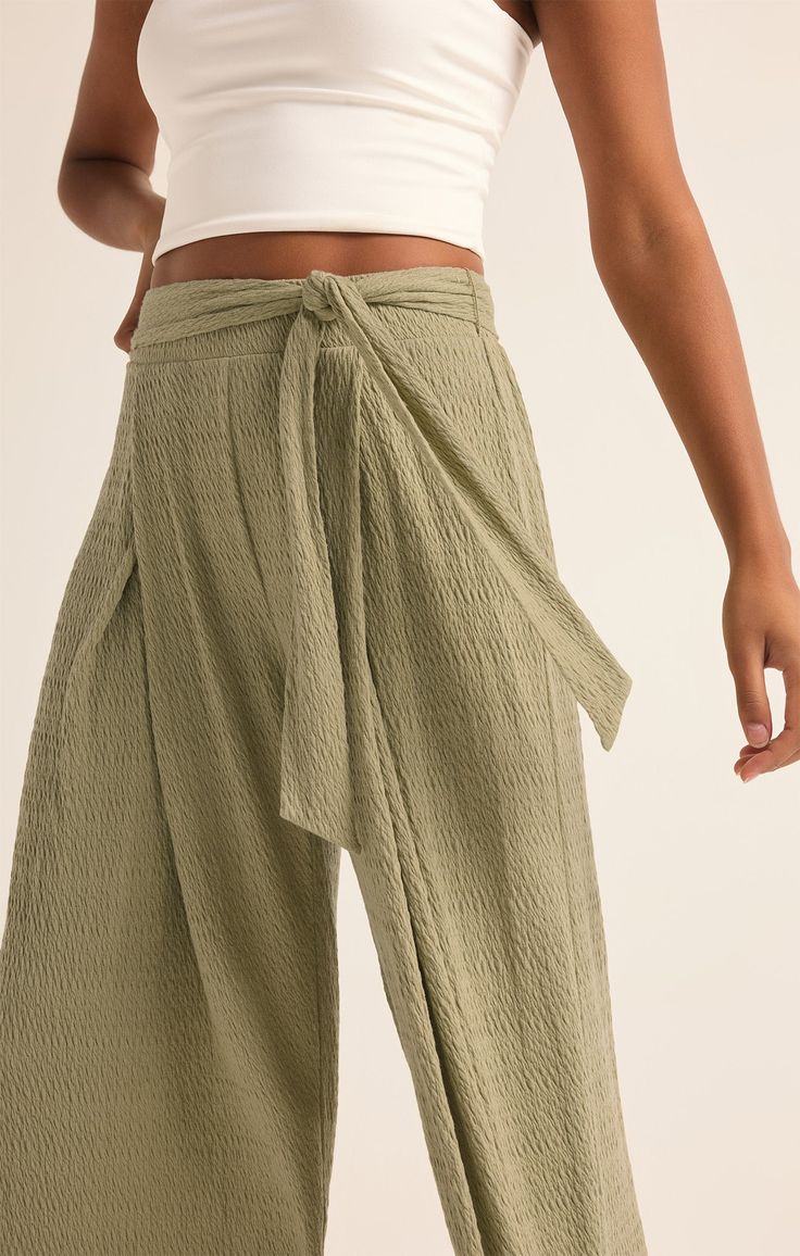 Take your casual look to the next level with the elevated, wide leg Isla Pucker Knit Pant. This pull on style features flattering details that will make this a pant you reach for on repeat. Effortless High-waisted Wide Leg Pants With Elastic Waistband, Chic Green Wide Leg Pants For Loungewear, Chic Green Relaxed Fit Wide Leg Pants, Chic Green Wide Leg Pants With Relaxed Fit, Effortless Wide Leg Pants With Elastic Waistband, Relaxed High Waist Wide Leg Pants For Spring, Chic Wide Leg Pants With Tie Waist, Effortless Wide Leg Bottoms With Elastic Waistband, Effortless High-waisted Pants