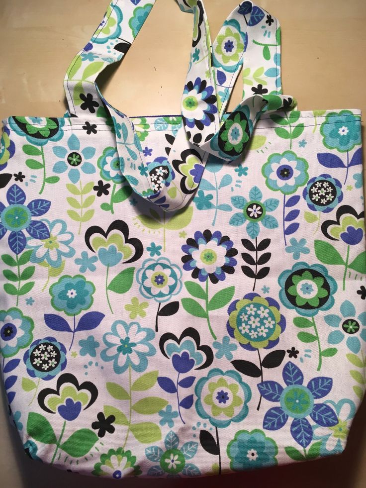 Put a little spring in your step! This bright and eye-catching little market bag is as beautiful as it is sturdy and utilitarian. This bag is fully lined with a matching blue canvas fabric.  15 x 12 inches. Make s great gift or present. Spring Green Canvas Bag For Shopping, Green Canvas Bag For Spring Shopping, Blue Canvas Beach Bag For Shopping, Blue Cotton Beach Bag For Shopping, Blue Canvas Bag For Spring, Green Canvas Bag For Spring, Blue Reversible Canvas Bag, Reversible Blue Canvas Tote Bag, Spring Canvas Tote Bag As Gift