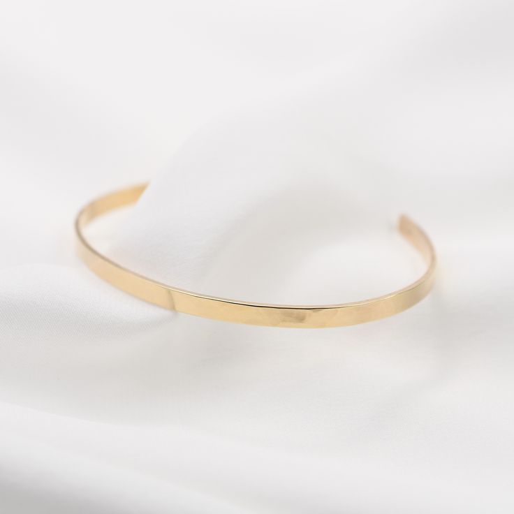 "14K gold cuff bracelet. 14K Gold Minimalist Cuff Bracelet * 14K solid gold. It is about 3mm x 1mm Please select the size of your wrist. If your wrist is 6\", please purchase 6\" bracelet. (If you order a 6\" bracelet, actual cuff length will be 5\" plus 1 inch opening.) Please read our policies before you place your order. https://www.etsy.com/shop/SashJewelry/policy?ref=shopinfo_policies_leftnav To see other Mother daughter necklace set click here: https://www.etsy.com/shop/SashJewelry?section Classic Gold Open Cuff Bracelet, Everyday Polished Yellow Gold Cuff Bracelet, Gold Open Cuff Bracelet With Polished Finish, Everyday Gold Open Cuff Bracelet, Minimalist Rose Gold Bracelet With Polished Finish, Minimalist Polished Rose Gold Bracelet, Gold Minimalist Cuff Bangle, Gold Cuff Bangle Minimalist Style, Modern 14k Gold Cuff Bracelet For Everyday